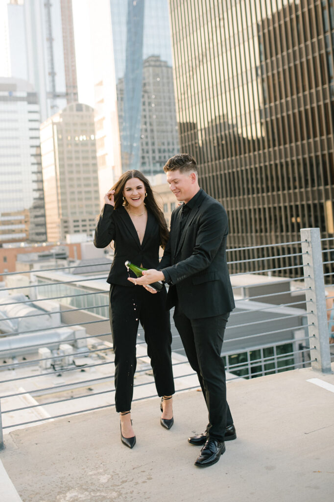 Candid, fun, documentary engagement photo on a rooftop downtown, top six engagement session location in austin texas.