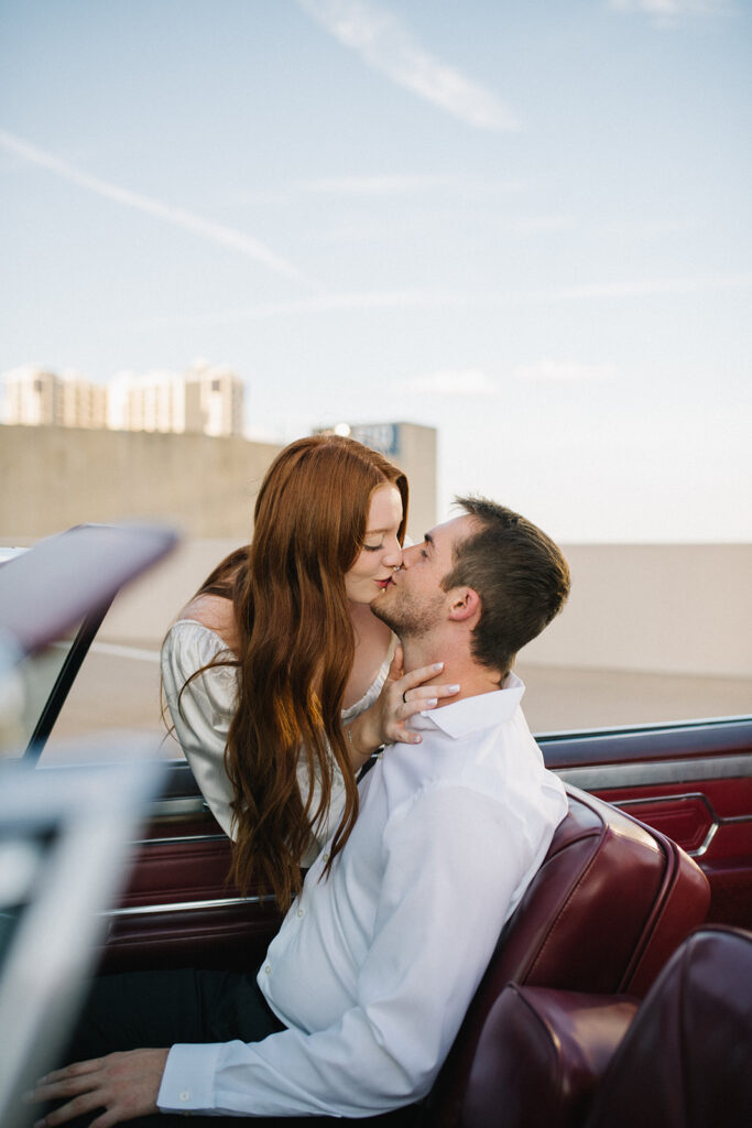 Candid, fun, documentary engagement photo on a rooftop downtown, top six engagement session location in austin texas.