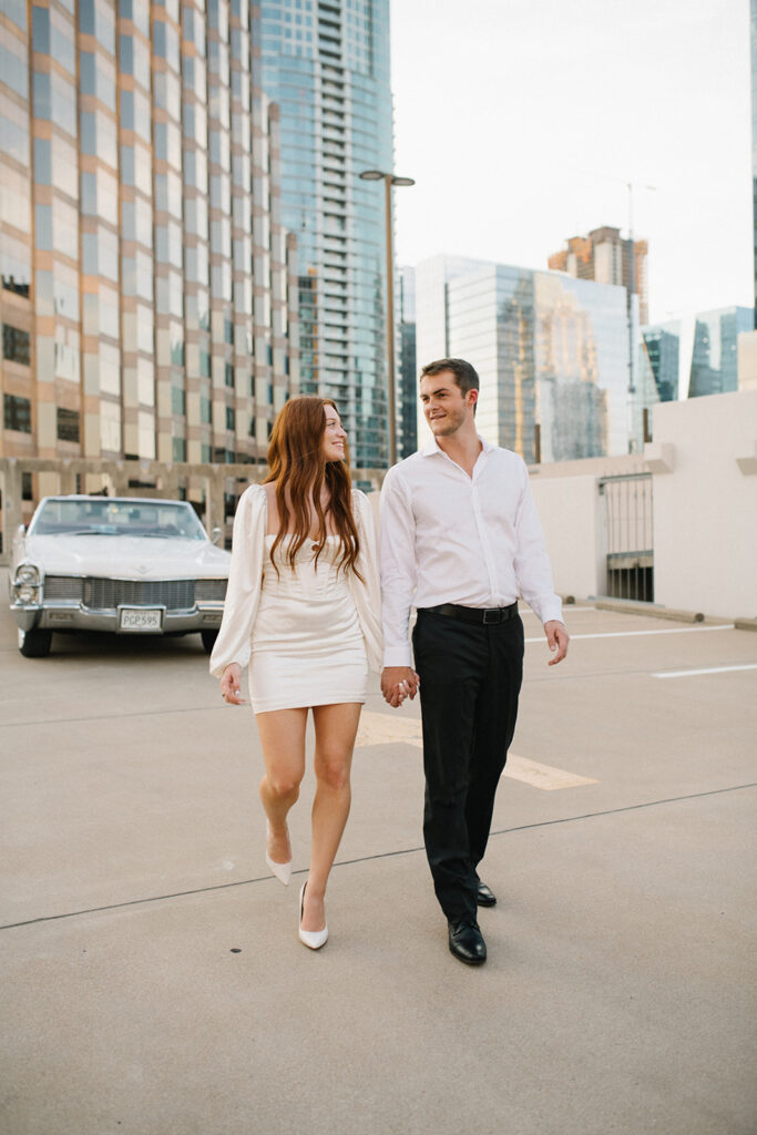 Candid and documentary engagement photo on a rooftop downtown, top six engagement session location in austin texas.