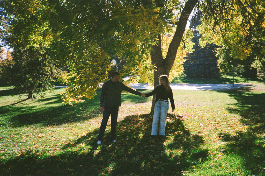 Denver engagement photographer capturing couple on film - candid and nostalgic memories