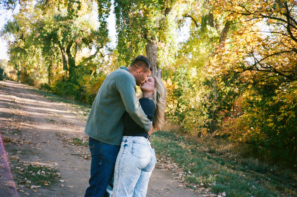 Denver engagement photographer capturing couple on film - candid and nostalgic memories
