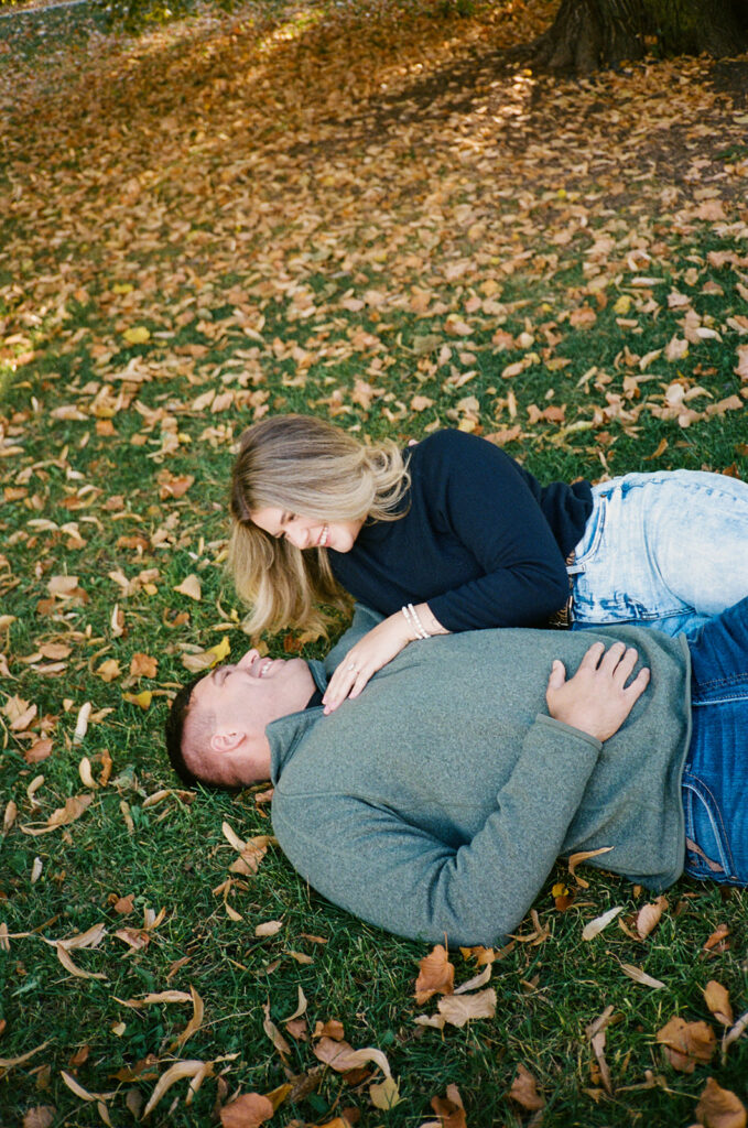 35mm film engagement session in Denver Colorado - couple laughing during golden hour
