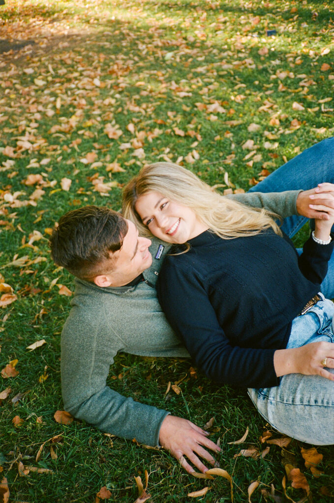 35mm film engagement session in Denver Colorado - couple laughing during golden hour