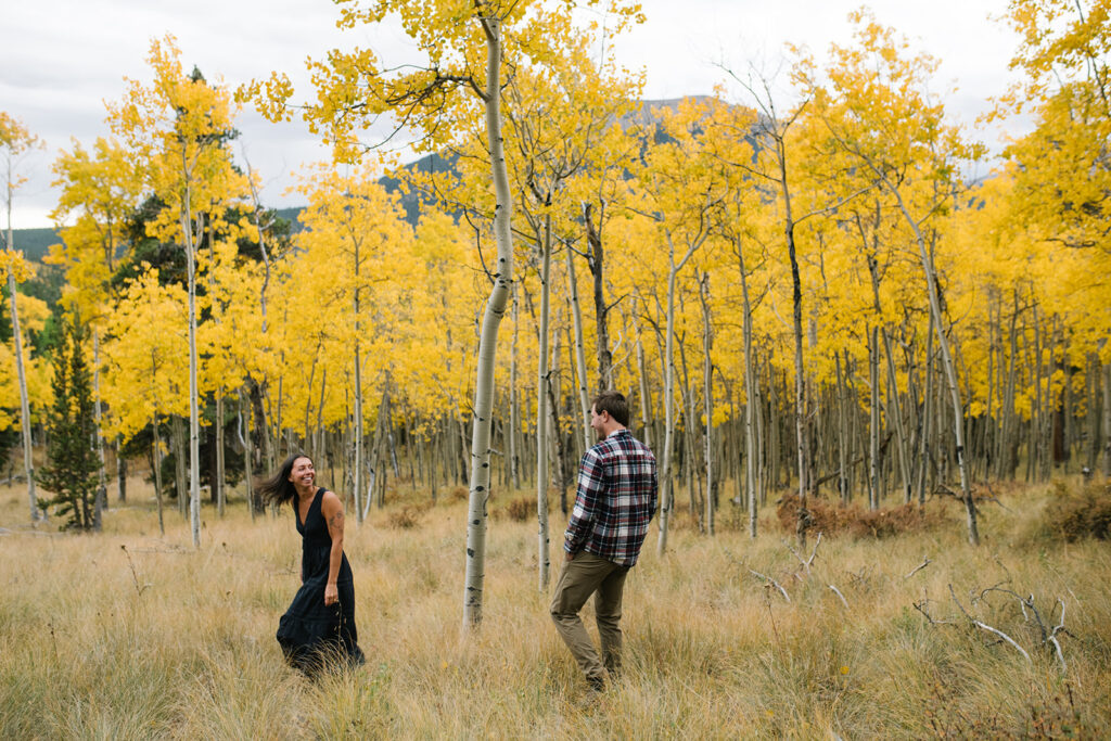 Romantic moment during a surprise proposal and engagement at Boreas Pass overlooking Breckenridg, Colorado.