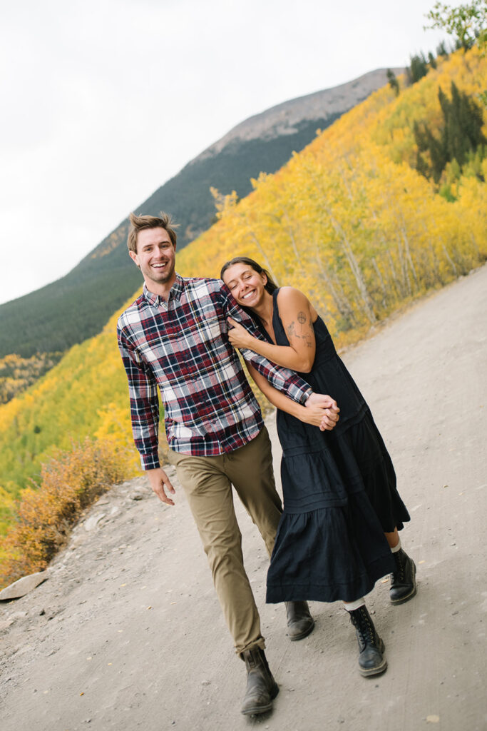 Romantic moment during a surprise proposal and engagement at Boreas Pass overlooking Breckenridg, Colorado.