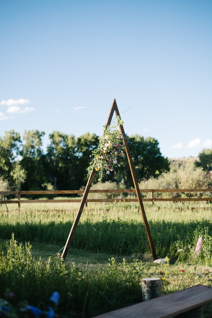 Wedding ceremony with mountain views at Shaw River Ranch wedding venue in Salida, Colorado, 