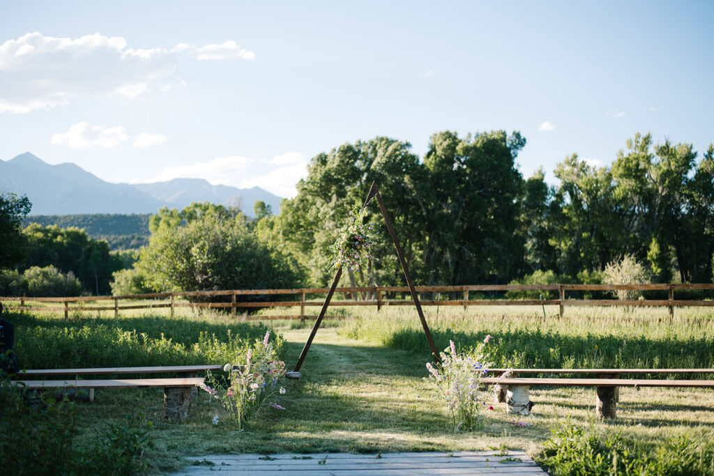 Wedding ceremony with mountain views at Shaw River Ranch wedding venue in Salida, Colorado, 