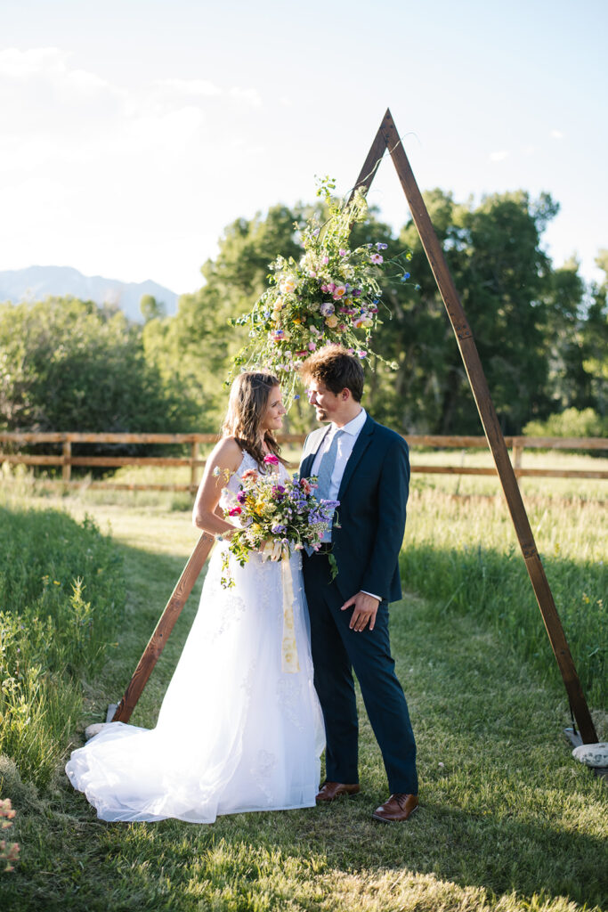 Wedding ceremony with mountain views at Shaw River Ranch wedding venue in Salida, Colorado, 