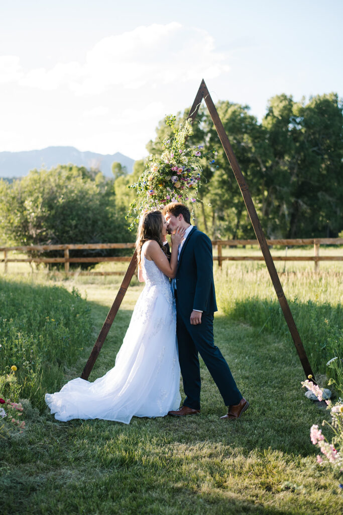 Wedding ceremony with mountain views at Shaw River Ranch wedding venue in Salida, Colorado, 