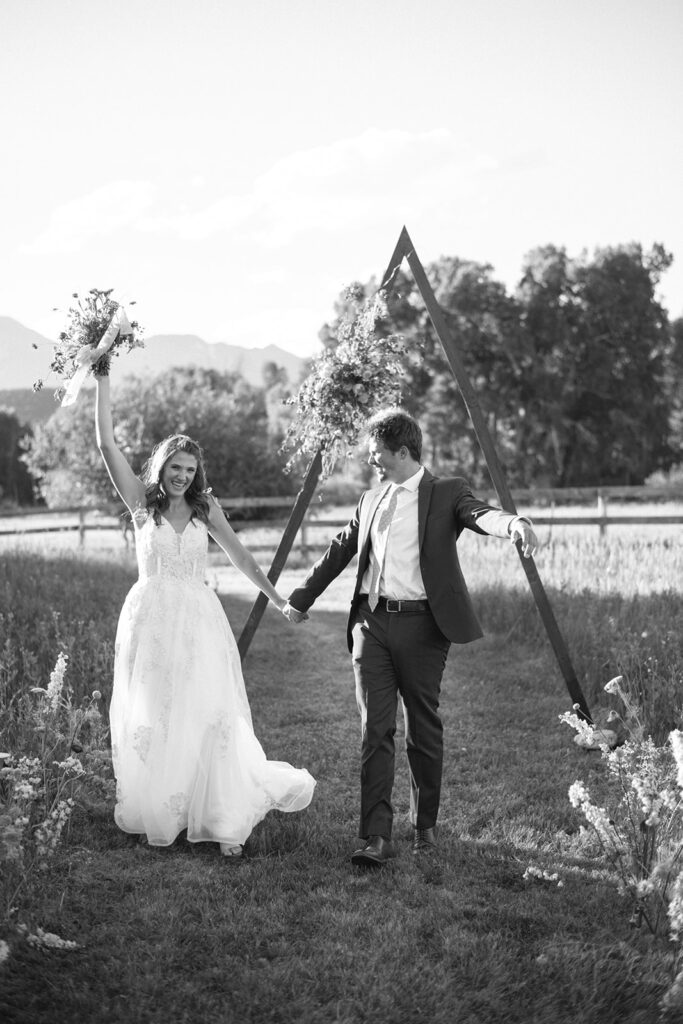 Wedding ceremony with mountain views at Shaw River Ranch wedding venue in Salida, Colorado, 