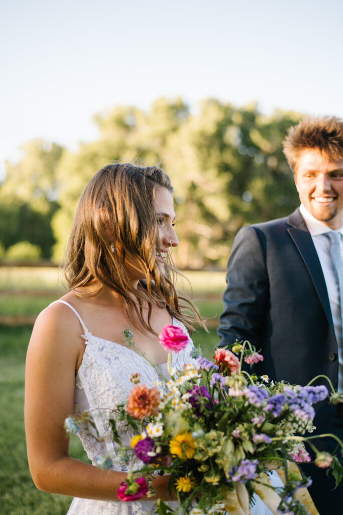 Wedding ceremony with mountain views at Shaw River Ranch wedding venue in Salida, Colorado, 