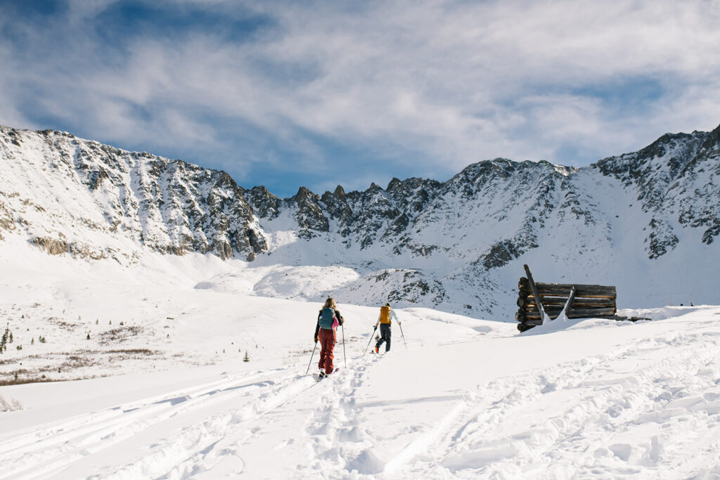 Couple during a snowy winter engagement session in Colorado’s Rocky Mountains.