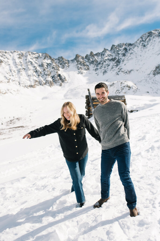 Couple during a snowy winter engagement session in Colorado’s Rocky Mountains.