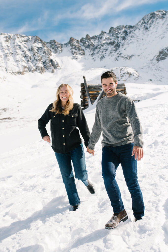 Couple during a snowy winter engagement session in Colorado’s Rocky Mountains.