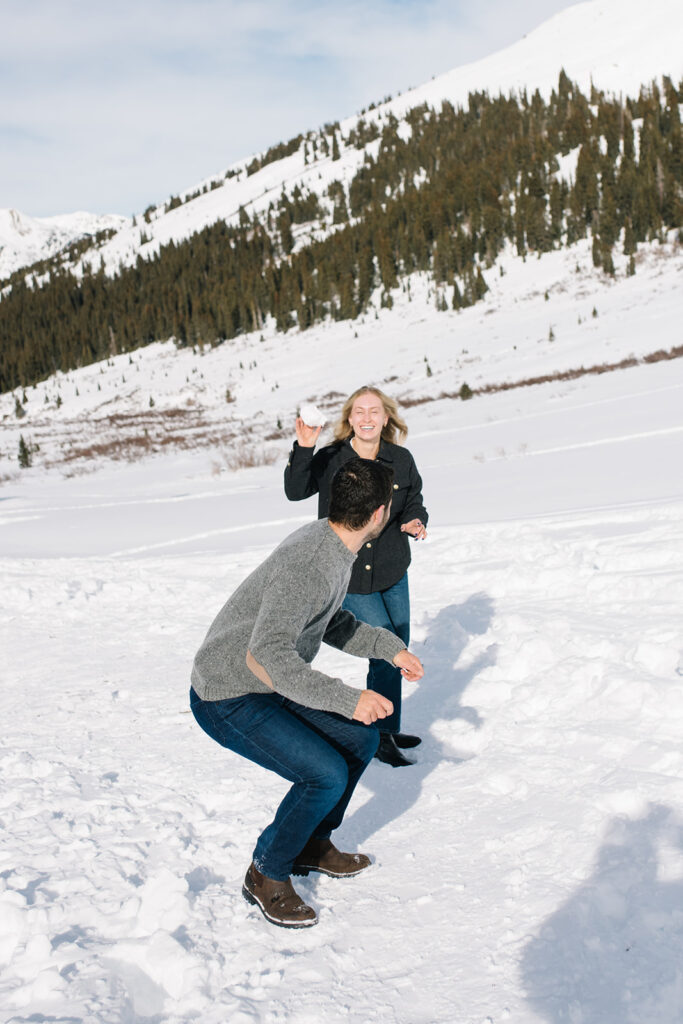 Colorado winter engagement session with a couple in the snow in skis. 