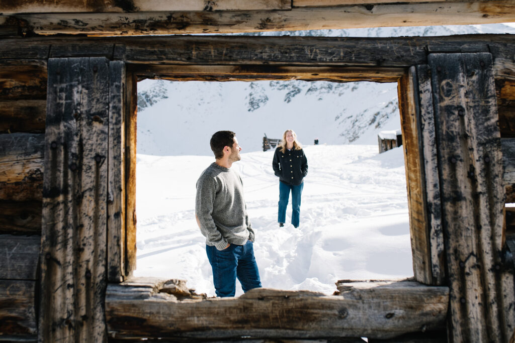 Couple during a snowy winter engagement session in Colorado’s Rocky Mountains.