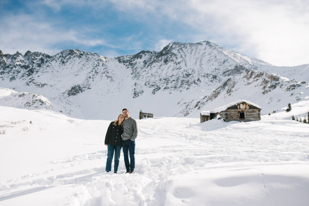 Couple during a snowy winter engagement session in Colorado’s Rocky Mountains.