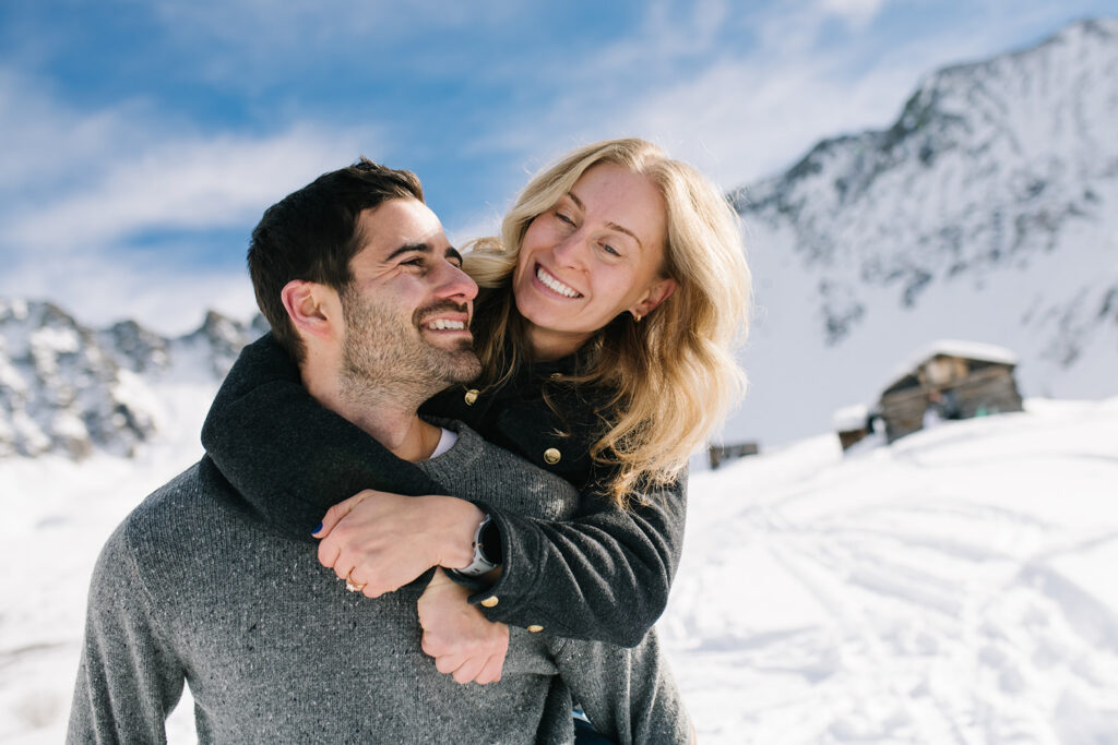 Couple during a snowy winter engagement session in Colorado’s Rocky Mountains.
