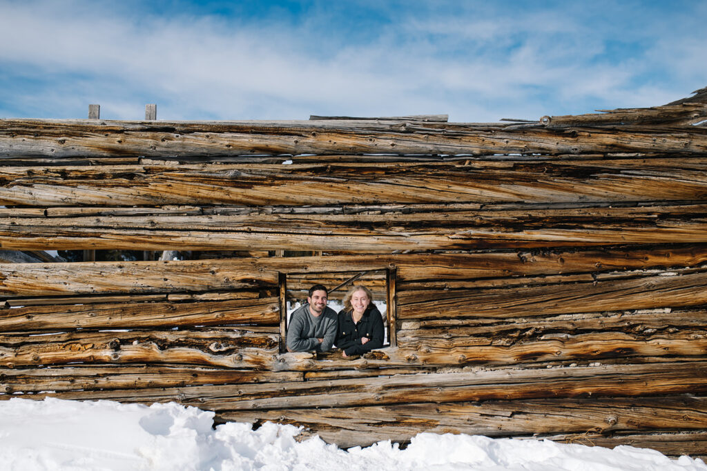 Couple during a snowy winter engagement session in Colorado’s Rocky Mountains.