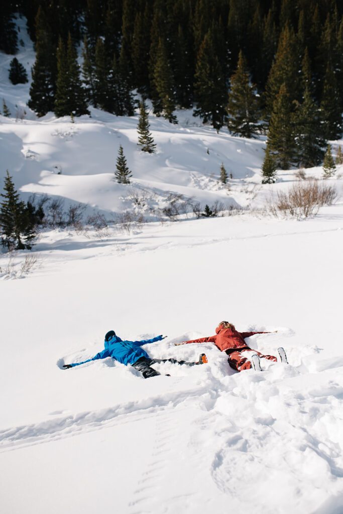 Colorado winter engagement session with a couple in the snow in skis. 