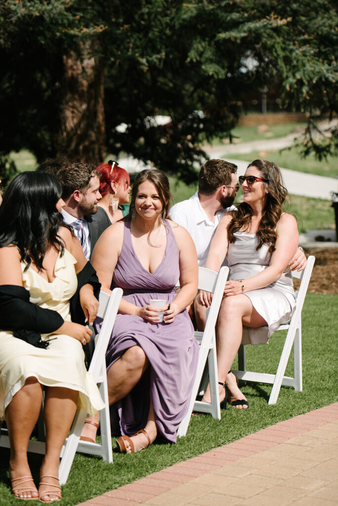 Inimate moments during the outdoor ceremony at Wedgewood Mountain View Ranch in Pine, CO with mountain views.