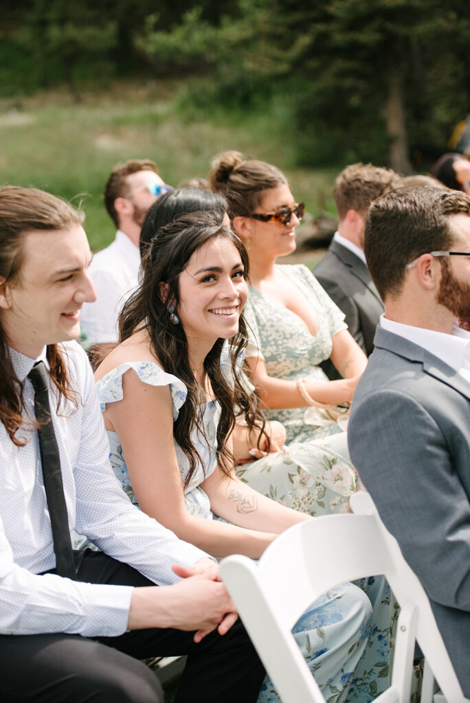 Inimate moments during the outdoor ceremony at Wedgewood Mountain View Ranch in Pine, CO with mountain views.