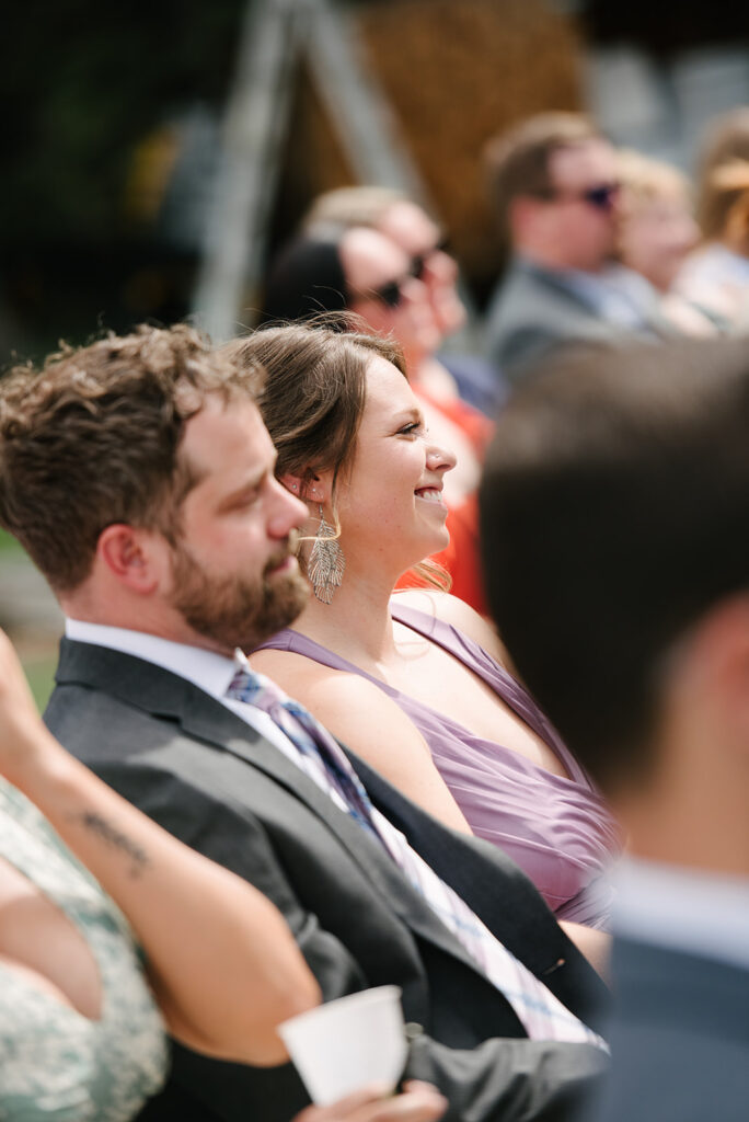 Inimate moments during the outdoor ceremony at Wedgewood Mountain View Ranch in Pine, CO with mountain views.