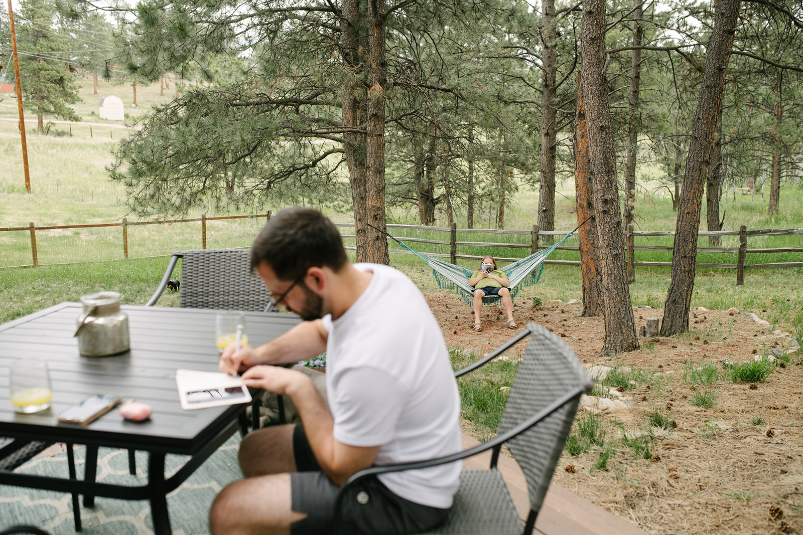 Getting ready at an airbnb off site at Wedgewood Mountain View Ranch  with mountain views and a rustic wooden arbor.