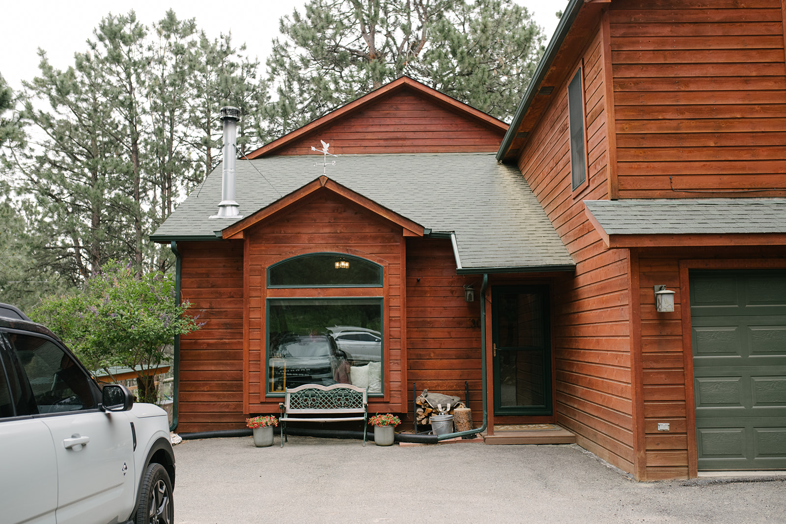 Getting ready at an airbnb off site at Wedgewood Mountain View Ranch in Pine, CO with mountain views and a rustic wooden arbor.