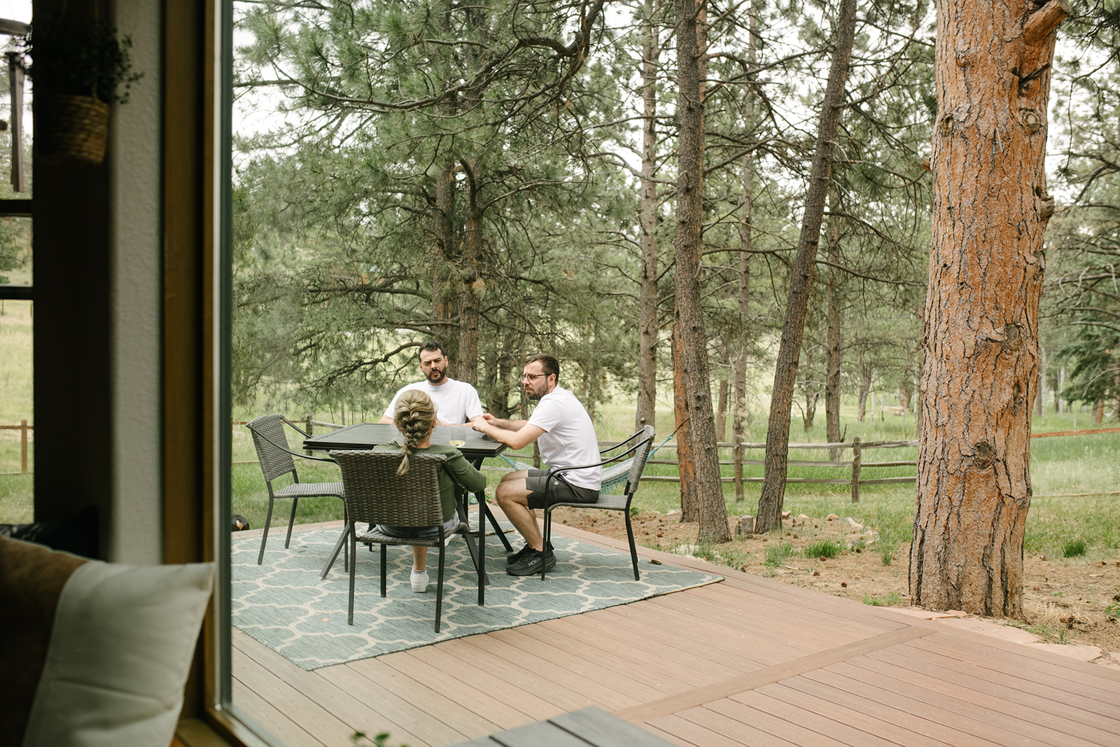 Getting ready at an airbnb off site at Wedgewood Mountain View Ranch in Pine, CO with mountain views and a rustic wooden arbor.