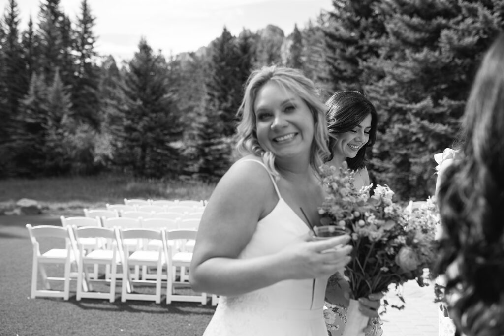 Bride and groom chatting with guests during cocktail hour at Wedgewood Mountain View Ranch wedding.