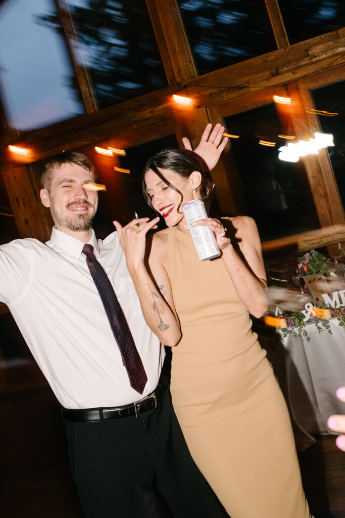 Late night dancing inside Wedgewood Mountain View Ranch’s lodge-style reception space.