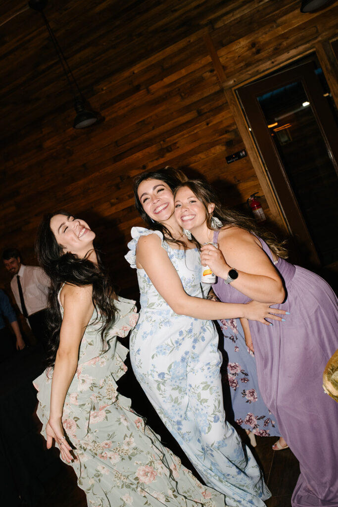 Late night dancing inside Wedgewood Mountain View Ranch’s lodge-style reception space.