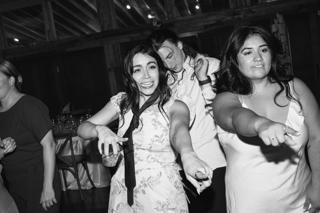 Late night dancing inside Wedgewood Mountain View Ranch’s lodge-style reception space.