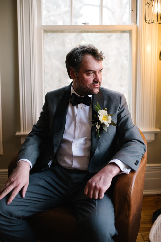 Groom upstairs room of Grant Humphreys Mansion before wedding ceremony
