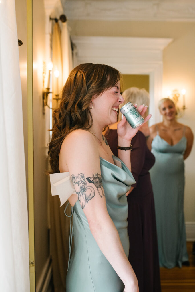 Candid photo of bride getting ready in vintage bridal suite at Grant Humphreys Mansion, denver wedding venue