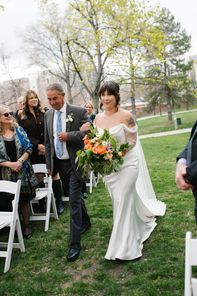 Intimate wedding ceremony outside Grant Humphreys Mansion venue
