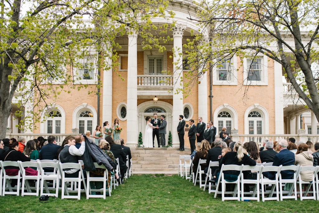Intimate wedding ceremony outside Grant Humphreys Mansion venue
