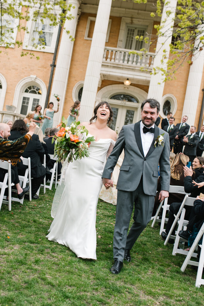 Intimate wedding ceremony outside Grant Humphreys Mansion venue

