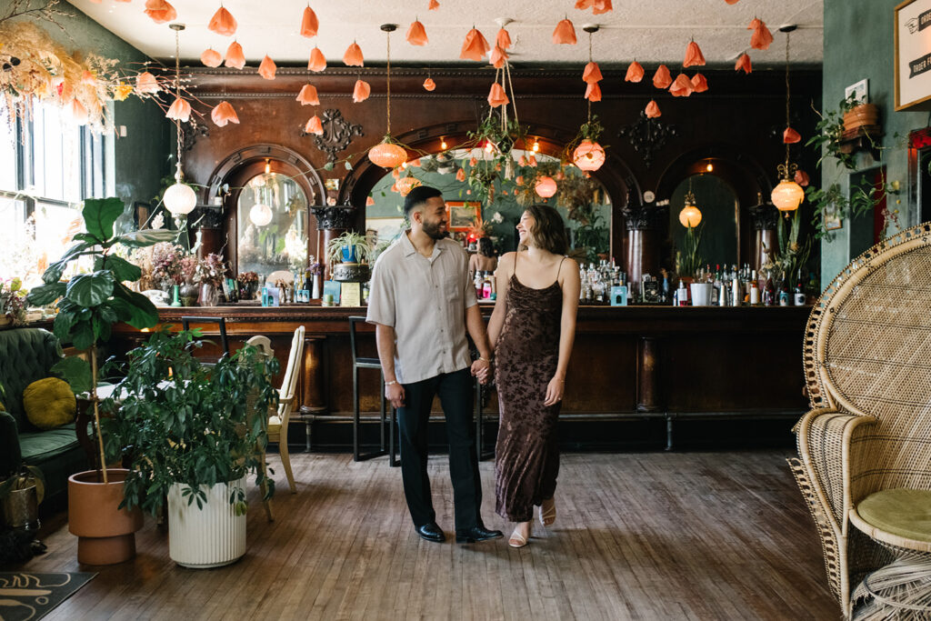 Engagement photos at Fort Greene Bar in Denver captured candidly