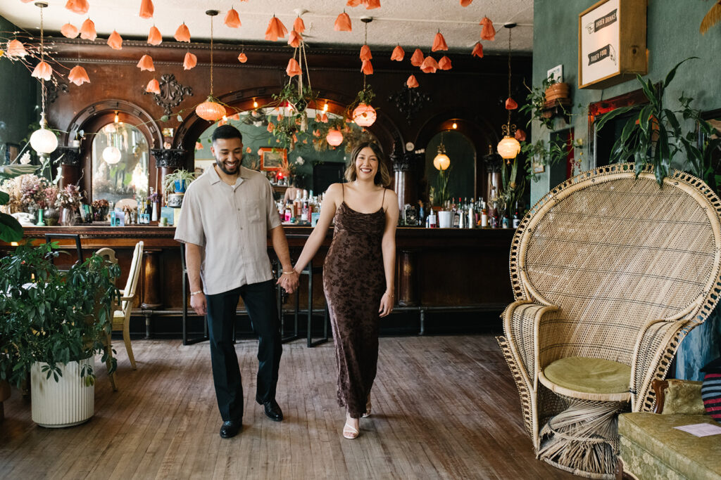 Denver engagement photo inside Fort Greene Bar’s moody interior