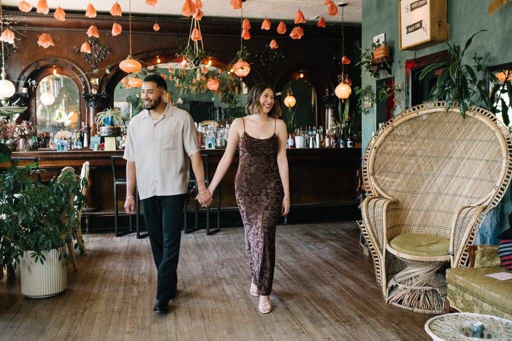 Denver engagement photo inside Fort Greene Bar’s moody interior