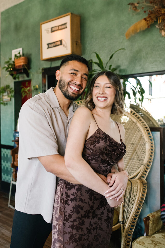 Denver engagement photo inside Fort Greene Bar’s moody interior