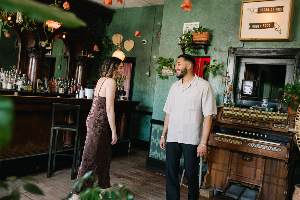 Engagement photos at Fort Greene Bar in Denver captured candidly