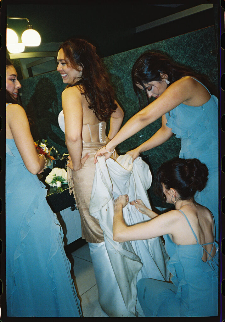candid moment of the bride and bridemaids in green briar inn wedding 