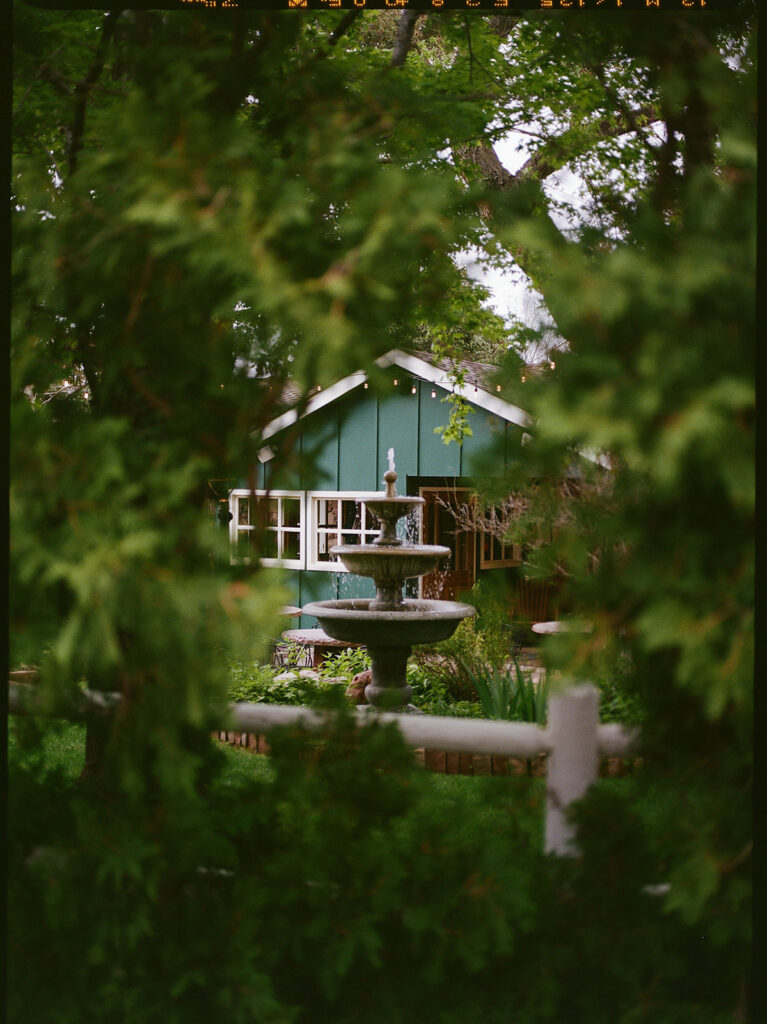The Greenbriar Inn wedding venue surrounded by lush spring greenery.