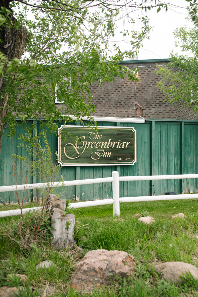 The Greenbriar Inn wedding venue surrounded by lush spring greenery.