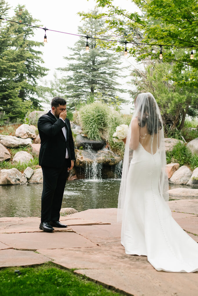Bride and groom laughing together during their rainy Greenbriar Inn wedding.