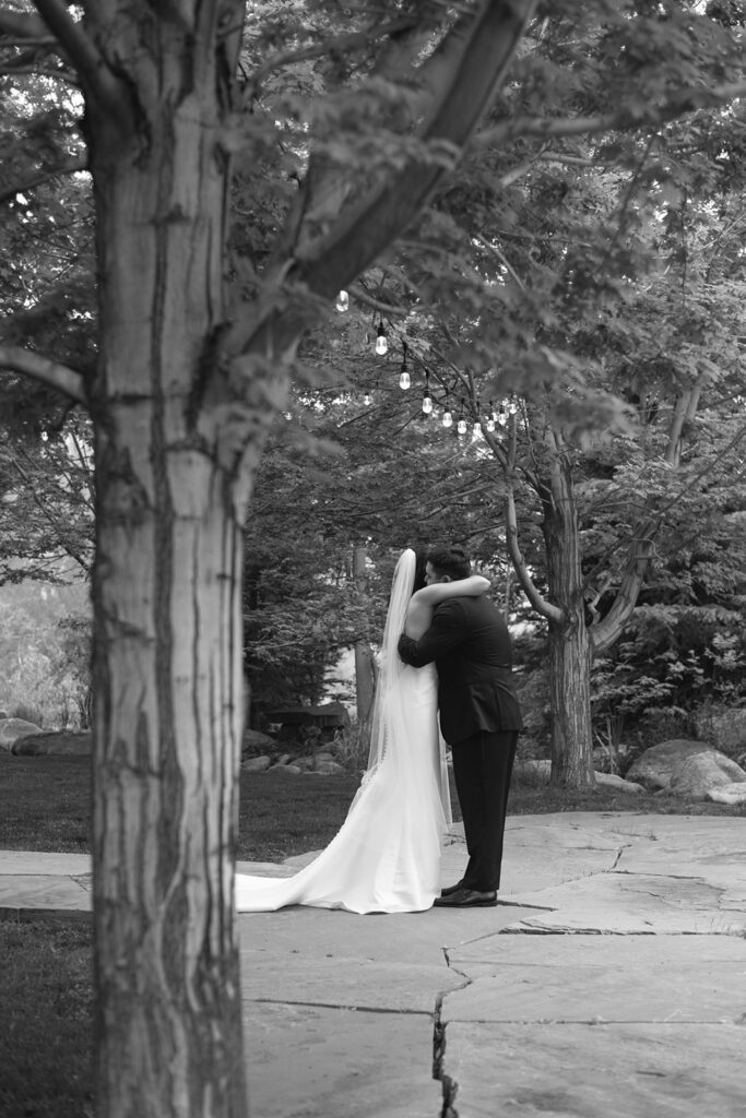 Bride and groom laughing together during their rainy Greenbriar Inn wedding.