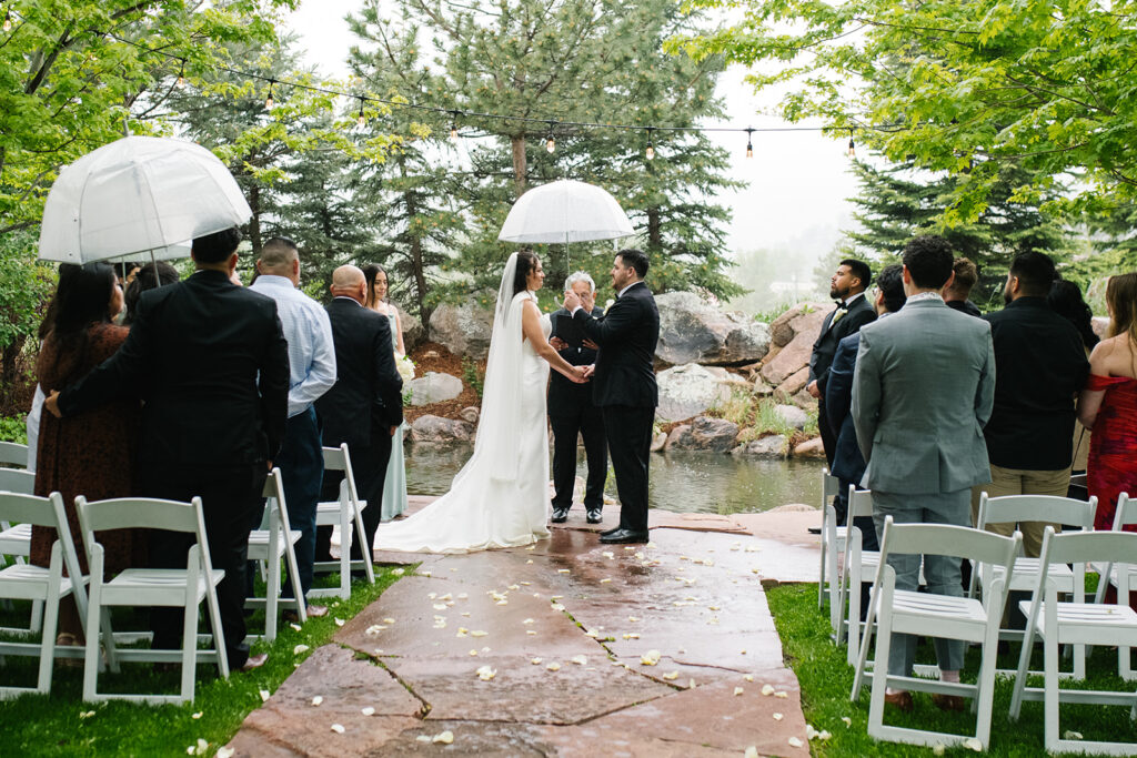 bride and groom exchanging vows during a Greenbriar Inn wedding ceremony.
